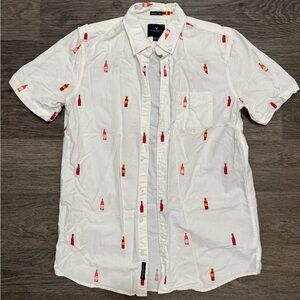 American Eagle White Short-Sleeve Button-Down Shirt with Red Bottle Motif